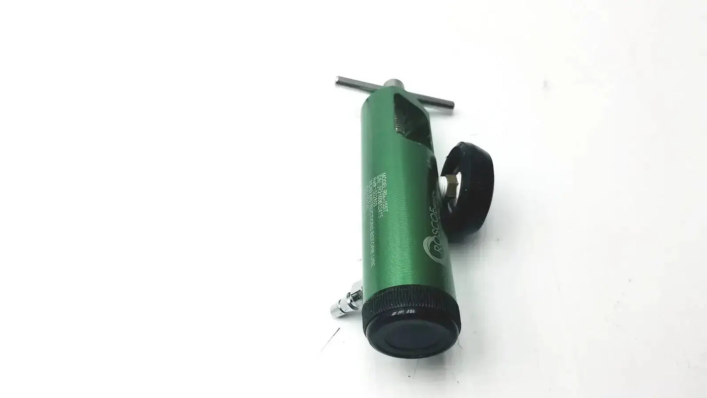 Green cylindrical roscoe medical mini oxygen regulator with black accents and t-shaped handle for medical use