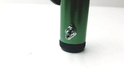 Green cylindrical roscoe medical mini oxygen regulator with black base and metallic nozzle for precise medical use