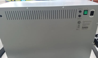 Gray metal power supply unit with ventilation slits and green indicator light on the back of sage products 7938 comfort personal cleansing warmer for reuse medical equipment