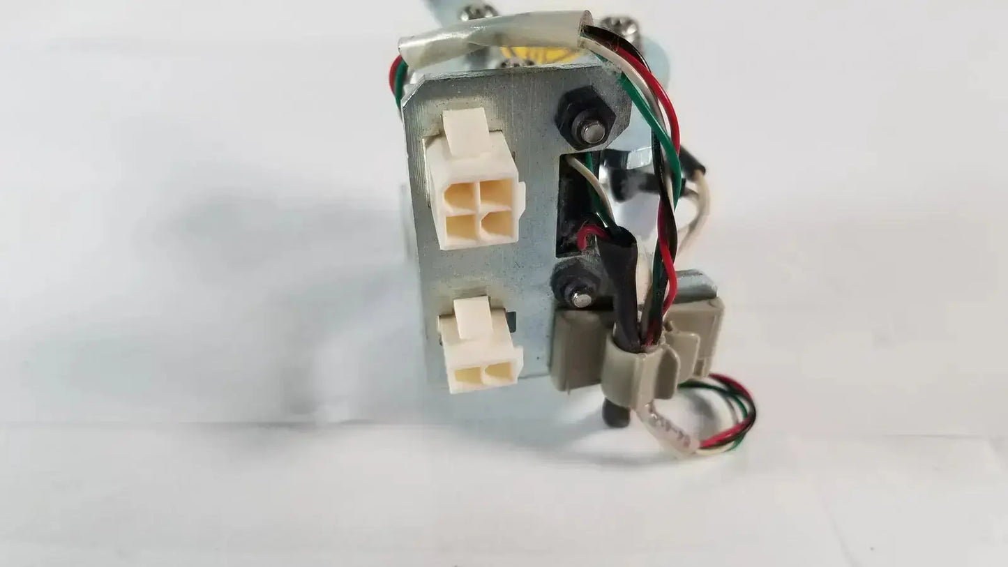 Metallic gray saia burgess motor with white plastic connectors and red green black wires from ledex products hospital surplus