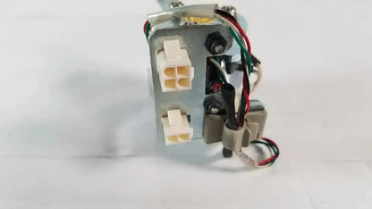 Metallic gray saia burgess motor with white plastic connectors and red green black wires from ledex products hospital surplus