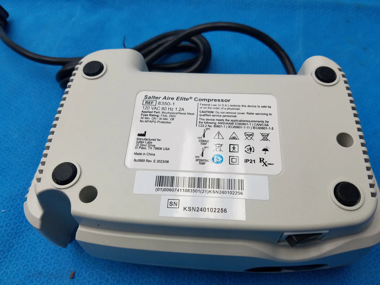 Gray plastic salter labs aire elite compressor nebulizer with black feet and label showing model number and certifications
