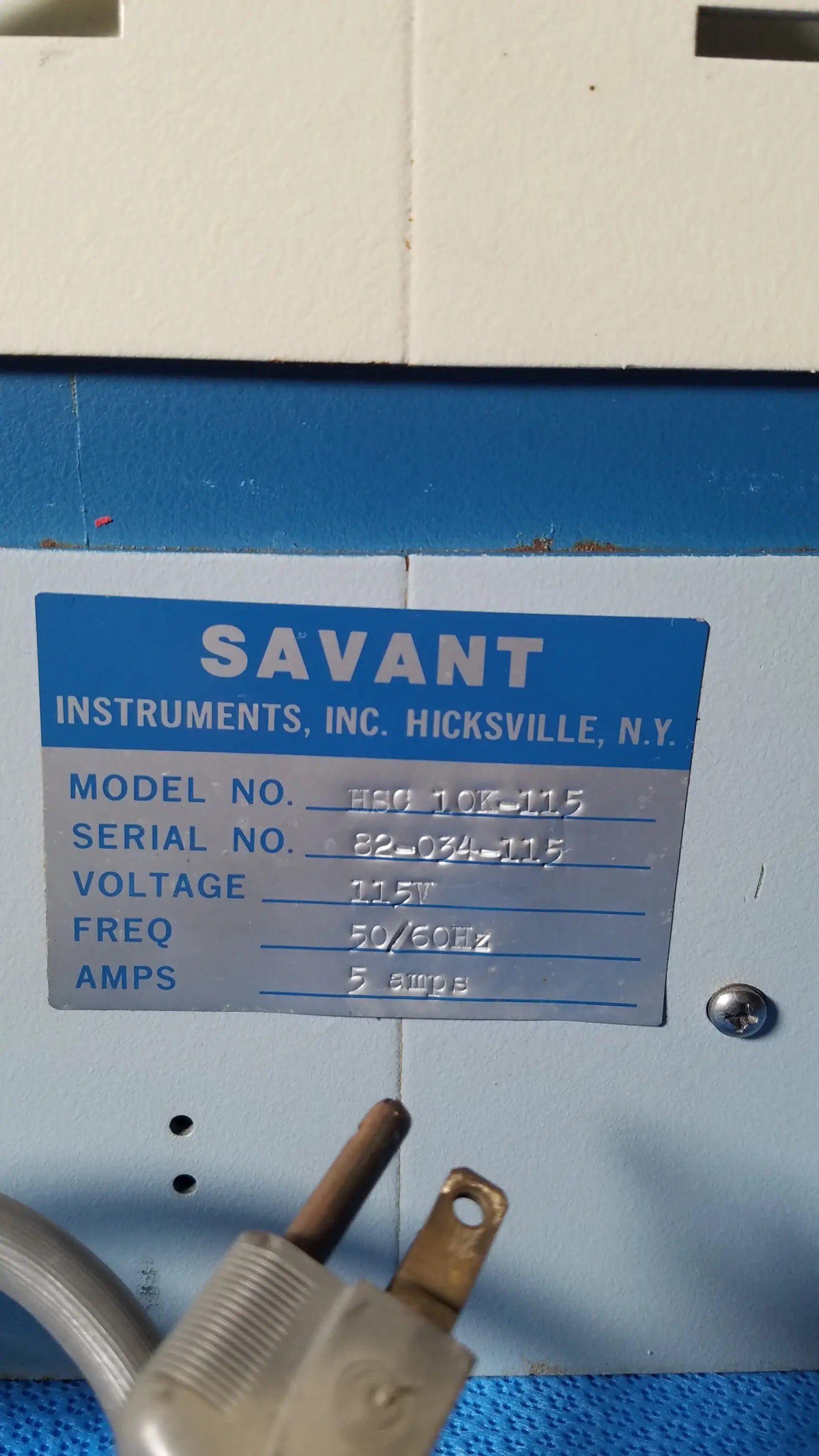 Blue and silver label on the savant instruments inc high speed centrifuge for reuse medical equipment applications