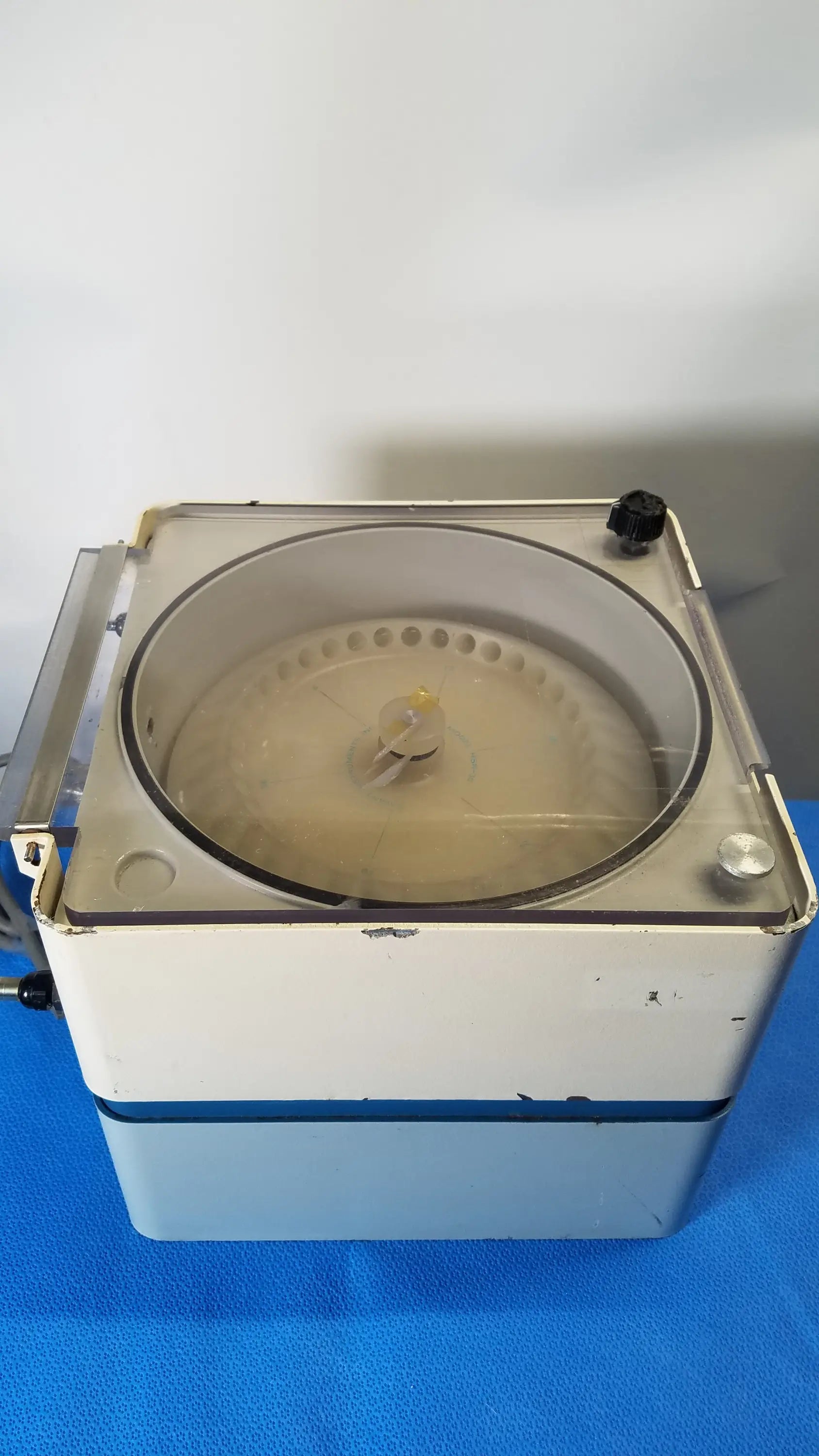 Savant HSC 10K-115 high speed centrifuge medical equipment in white and blue with clear circular rotor chamber for reuse medical equipment