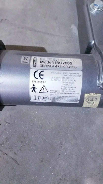 Silver cylindrical industrial motor with certification marks on the back side of scifit iso 7000 upright exercise bike