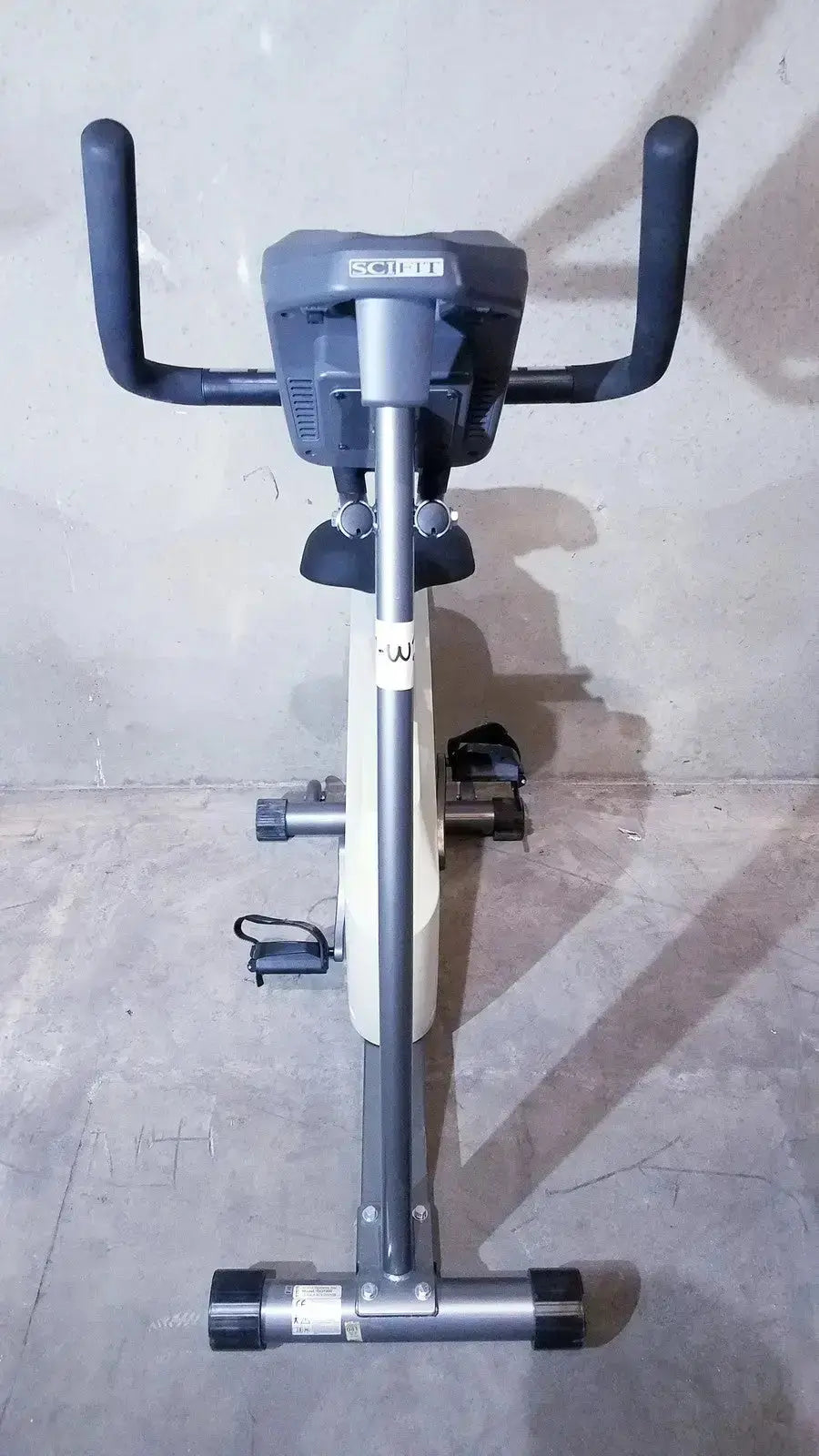 Gray and black scifit iso 7000 upright exercise bike with digital display panel for effective upright exercise sessions