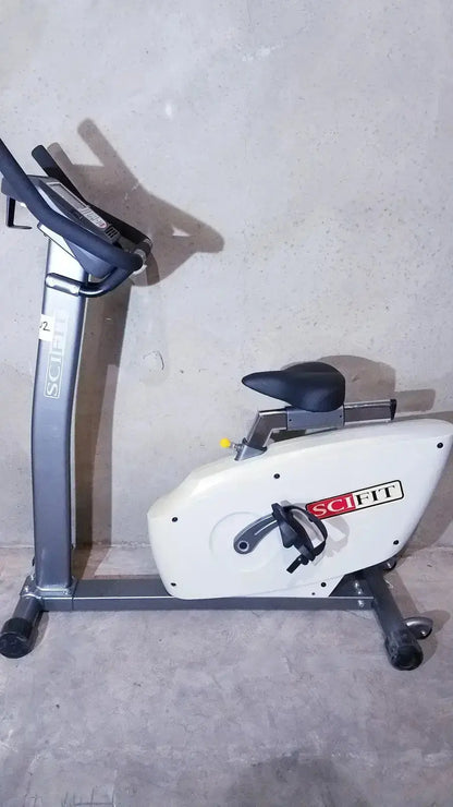 SciFit ISO 7000 upright exercise bike in white and gray with black seat and handlebars for effective upright exercise