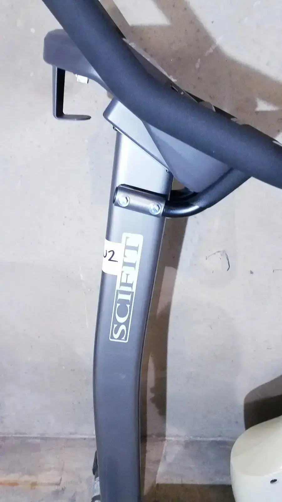 Gray metal frame upright exercise bike featuring scifit branding in the sciFit ISO 7000 upright exercise bike model