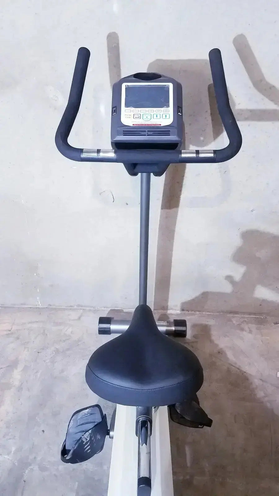 Black and silver SciFit ISO 7000 upright exercise bike with digital display console for effective upright exercise