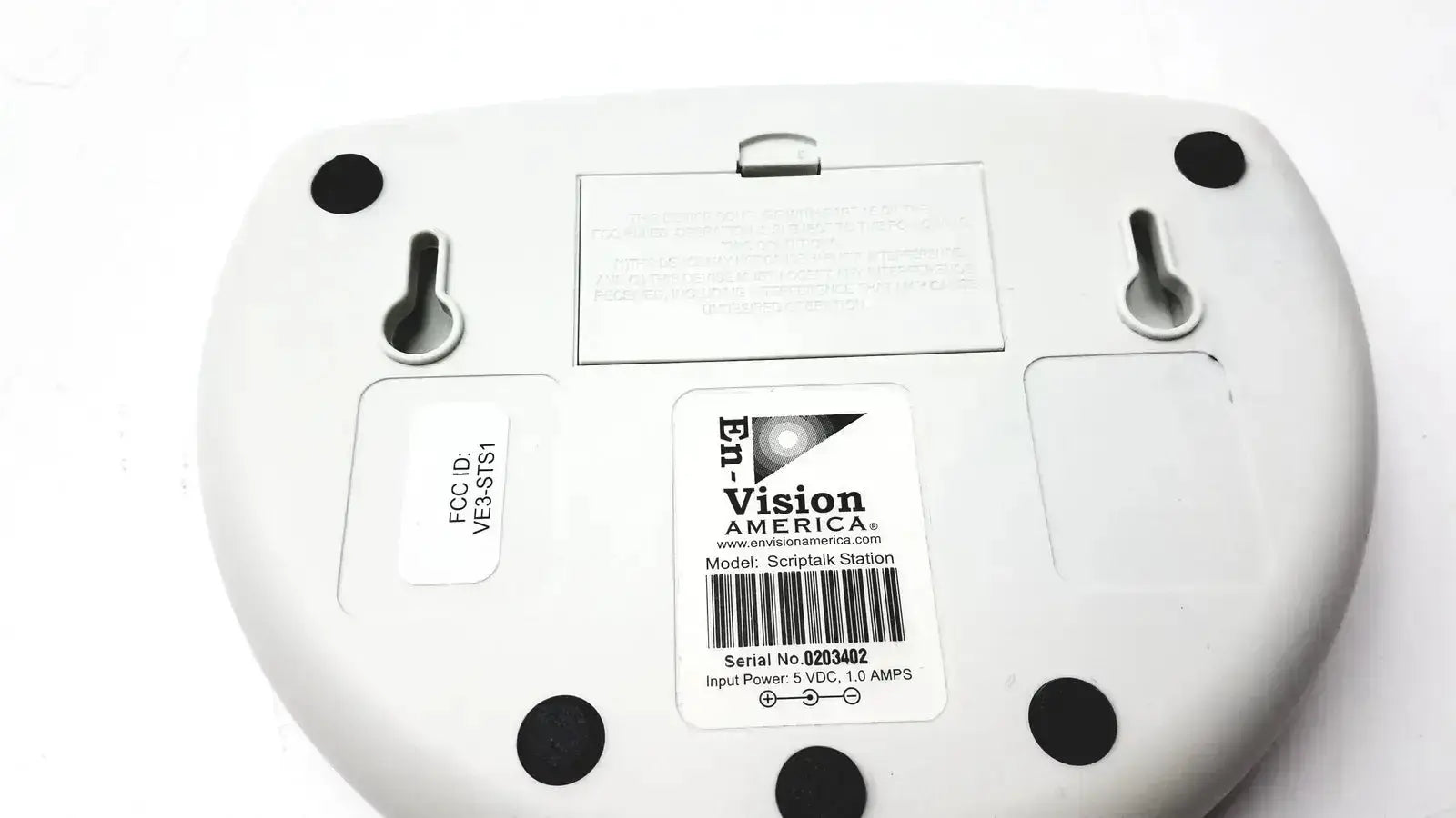 White plastic Script Talk Station audible prescription reading device with black feet and central model label visible