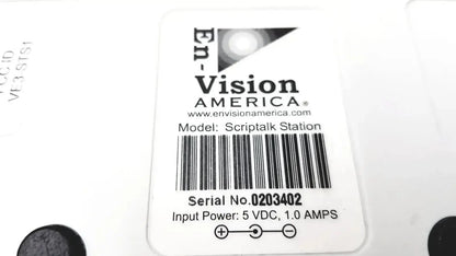 White rectangular label with black text and logo on back of script talk station 0203402 prescription reading device