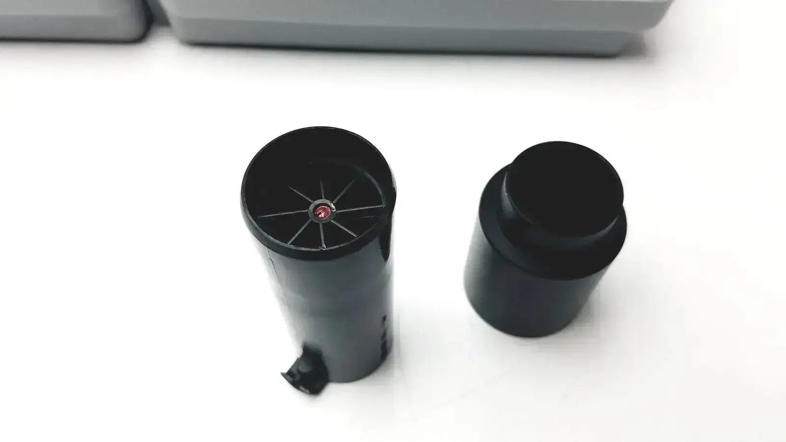Black cylindrical ink cartridge with red dot and radial slots on top next to cap for sdi-astra 300 spirometer buy used medical equipment