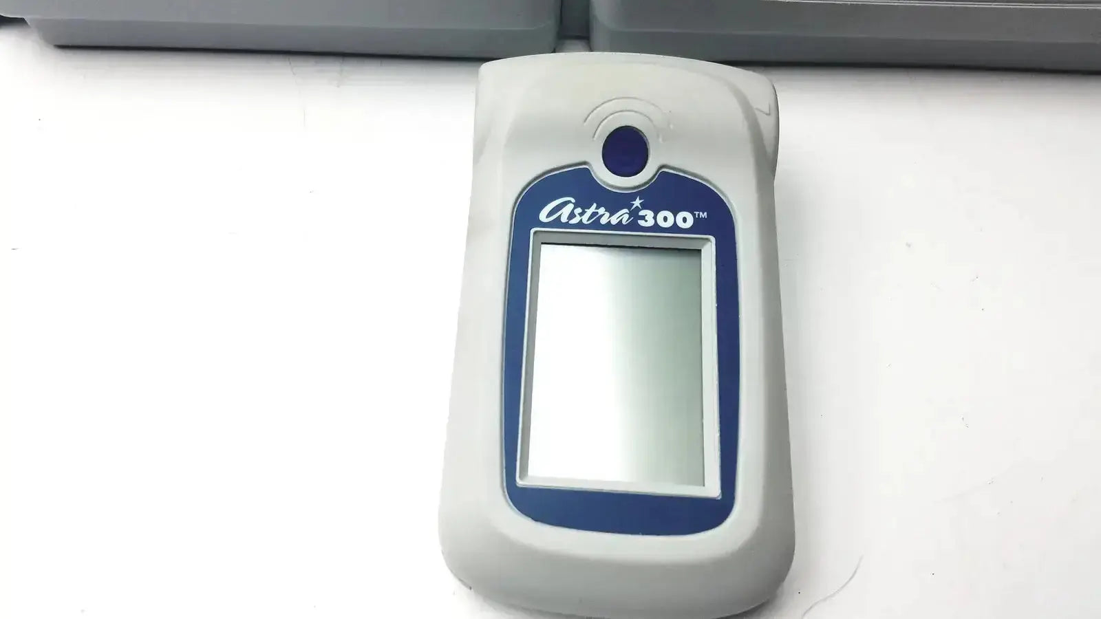 Gray and blue astra 300 handheld spirometer with rectangular screen available as pre owned medical equipment for sale