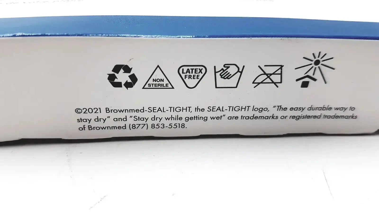 White label with blue border on the back of seal tight original cast bandage protector indicating latex-free and machine washable