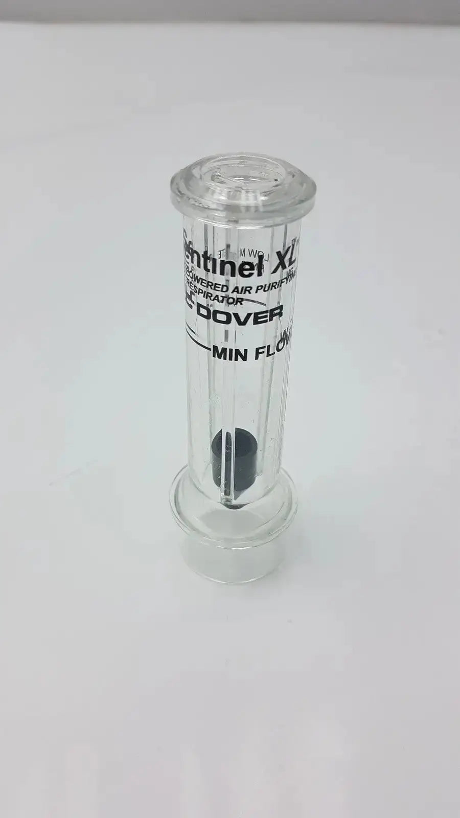 Clear glass cylindrical air purifier with black internal flow meter and printed sentinel xl ilc dover min branding