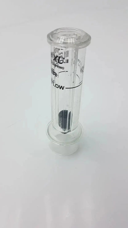 Clear cylindrical sentinel xl ilc dover min flow meter with black internal components and printed markings
