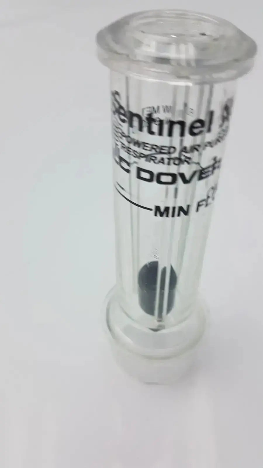 Clear plastic sentinel xl ilc dover min flow meter powered air purifier respirator with black filter and white labeling