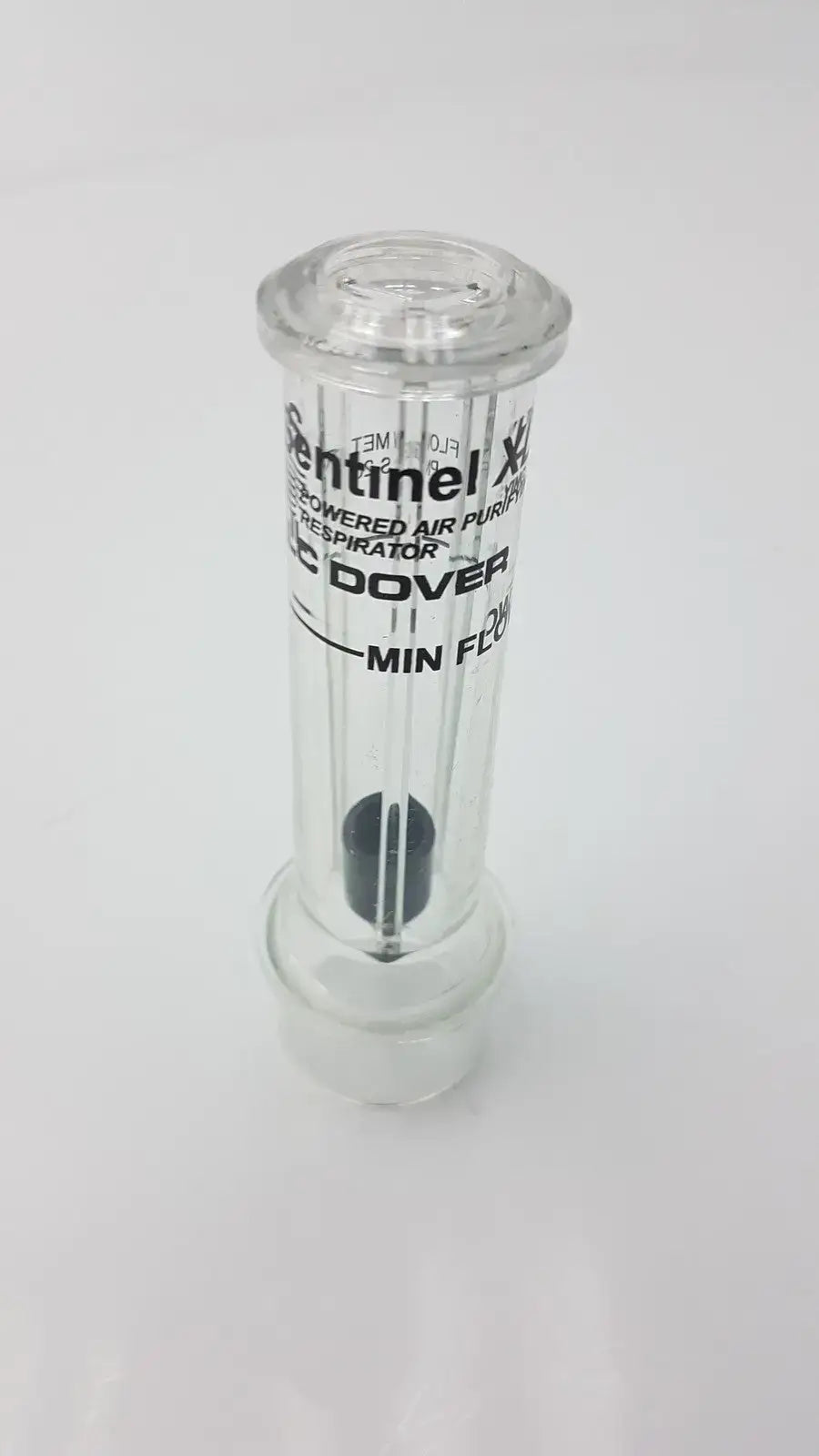 Clear glass cylindrical air purifier respirator with black filter and white sentinel xl ilc dover min flow meter branding