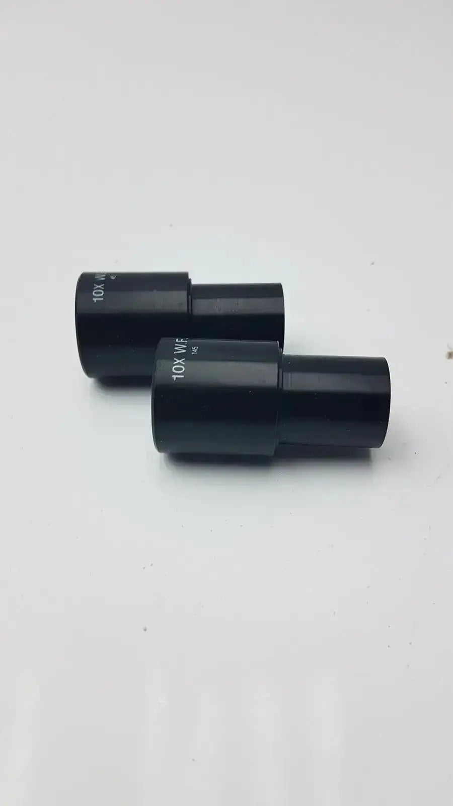 Set of 2 black matte metal american optical 10x eyepieces with engraved markings for microscope use