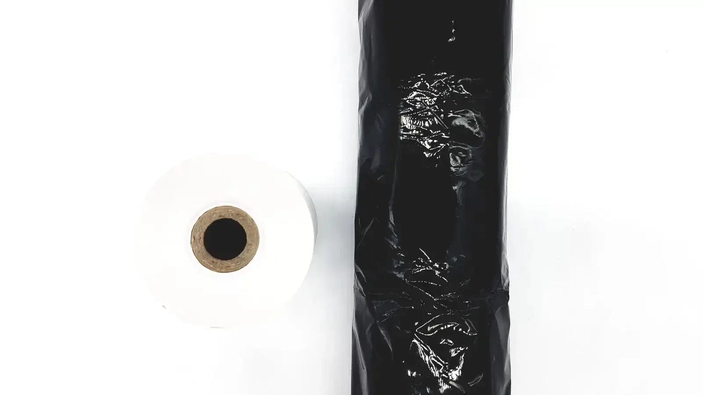 A roll of black plastic thermal register roll with a glossy crinkled surface included in a set of 4 register rolls