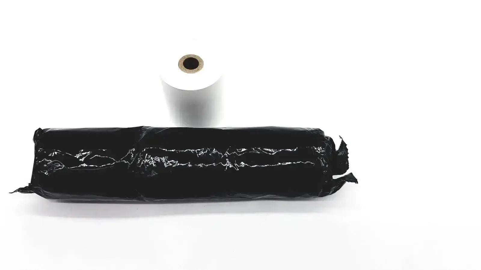 Black plastic-wrapped roll of adhesive thermal register tape with white paper core for set of 4 thermal register rolls
