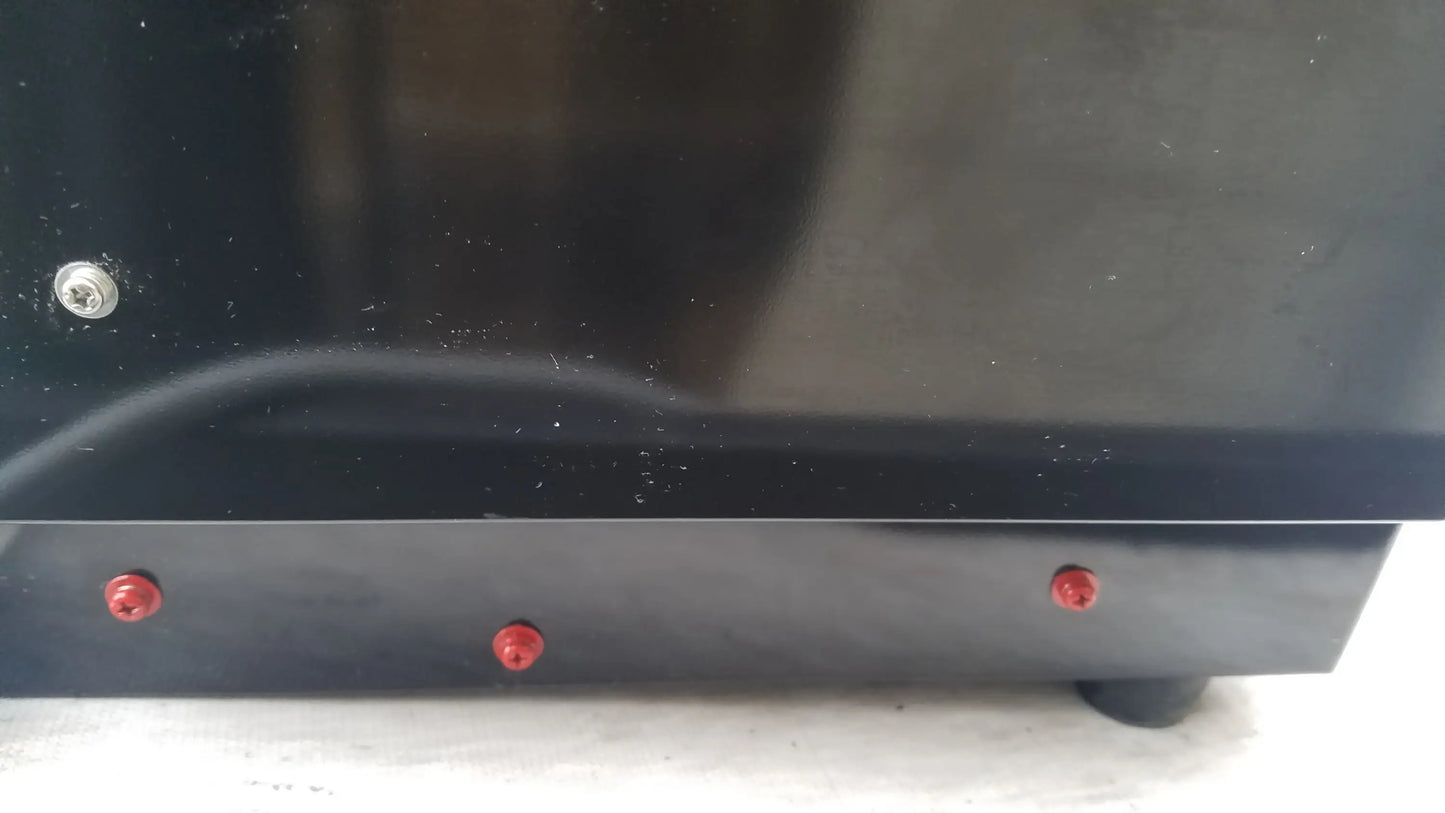 Black glossy base of shimadzu mce-202 multina microchip electrophoresis medical equipment with red and silver screws