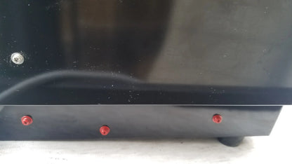 Black glossy base of shimadzu mce-202 multina microchip electrophoresis medical equipment with red and silver screws
