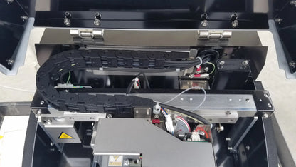 Black rubberized protective chain inside metallic shimadzu mce-202 multina microchip electrophoresis medical equipment