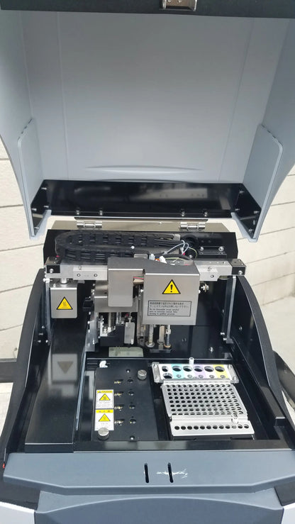 Black and gray Shimadzu MCE-202 multina microchip electrophoresis medical equipment with hinged lid and sample trays