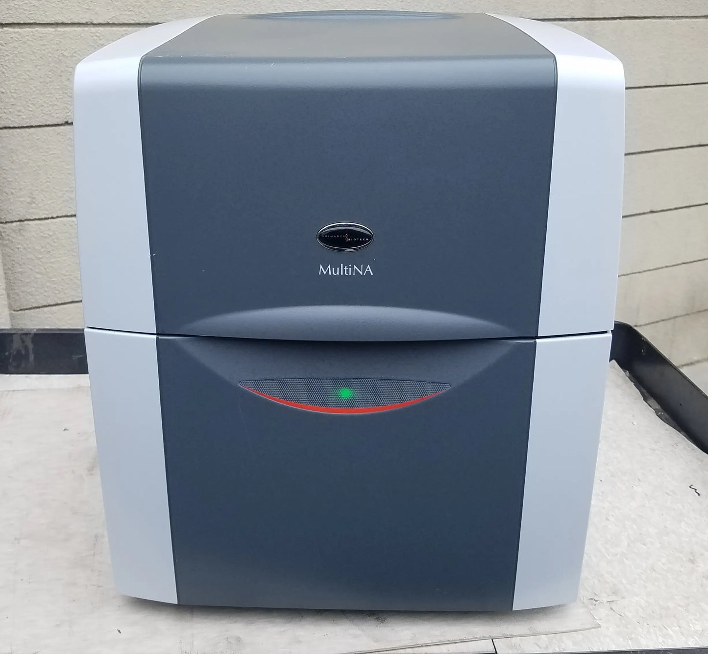 Shimadzu MCE-202 multina microchip electrophoresis system with gray white body and green indicator light for medical equipment use