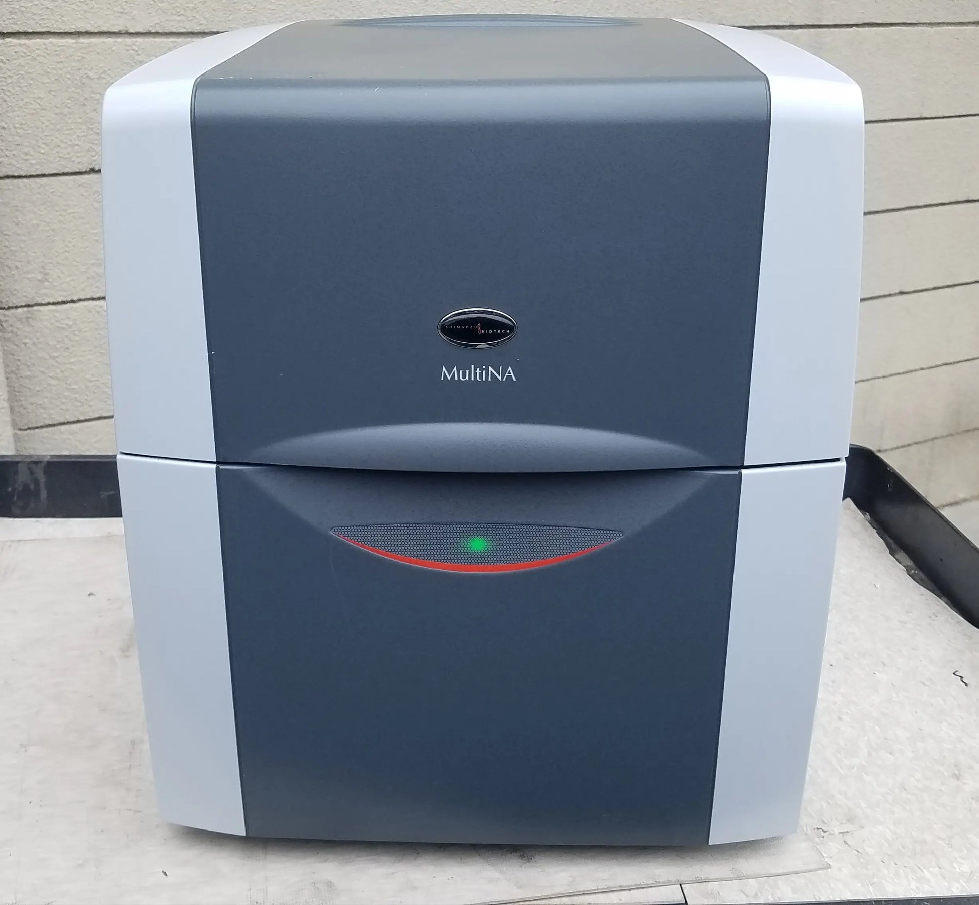Shimadzu MCE-202 multina microchip electrophoresis system with gray white body and green indicator light for medical equipment use
