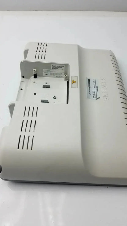 White plastic siemens kt-lm215fds fhd flat panel display monitor with ventilation slits and labeled stickers on the back side