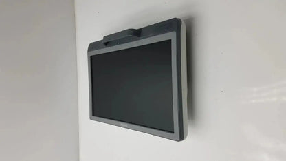 Gray plastic Siemens kt-lm215fds fhd flat panel display monitor with black screen and small handle mounted on wall