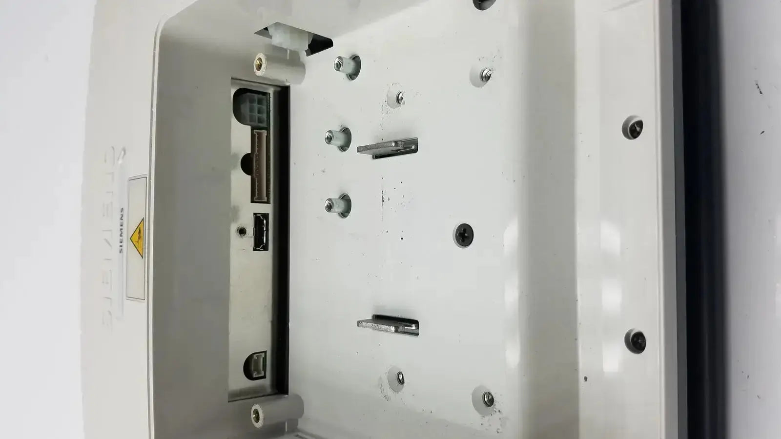 White plastic outdoor electrical junction box with usb ports on back side of siemens kt-lm215fds fhd flat panel monitor
