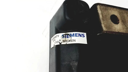 Black industrial hydraulic cylinder with torn white siemens warranty seal on siemens cincinnati milacron cnc lathe controller back side