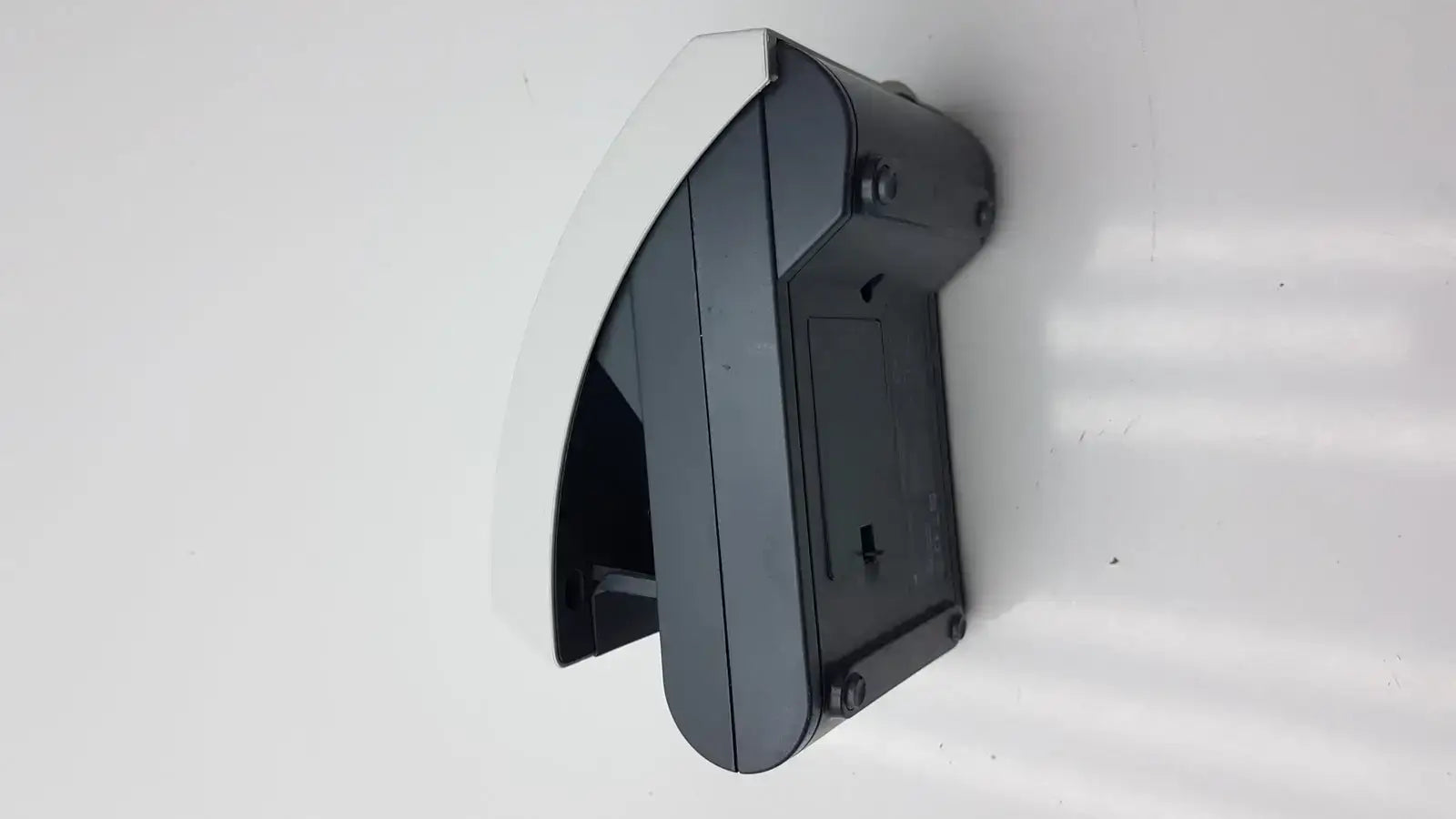 Siemens clinitek status analyzer with curved angular black and white plastic wall-mounted design for medical use
