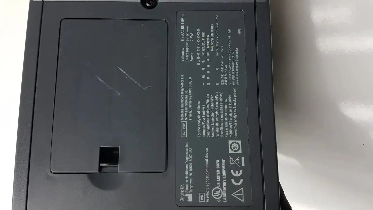 Black rectangular siemens clinitek status analyzer medical device with matte finish and labeled specifications on back panel