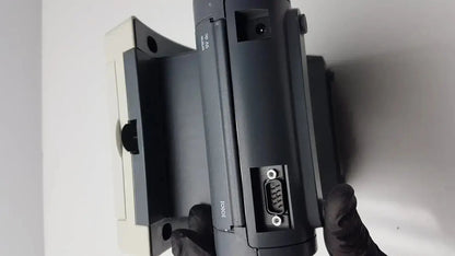 Black iolink barcode scanner with rectangular body and visible ports for siemens clinitek status analyzer 004979