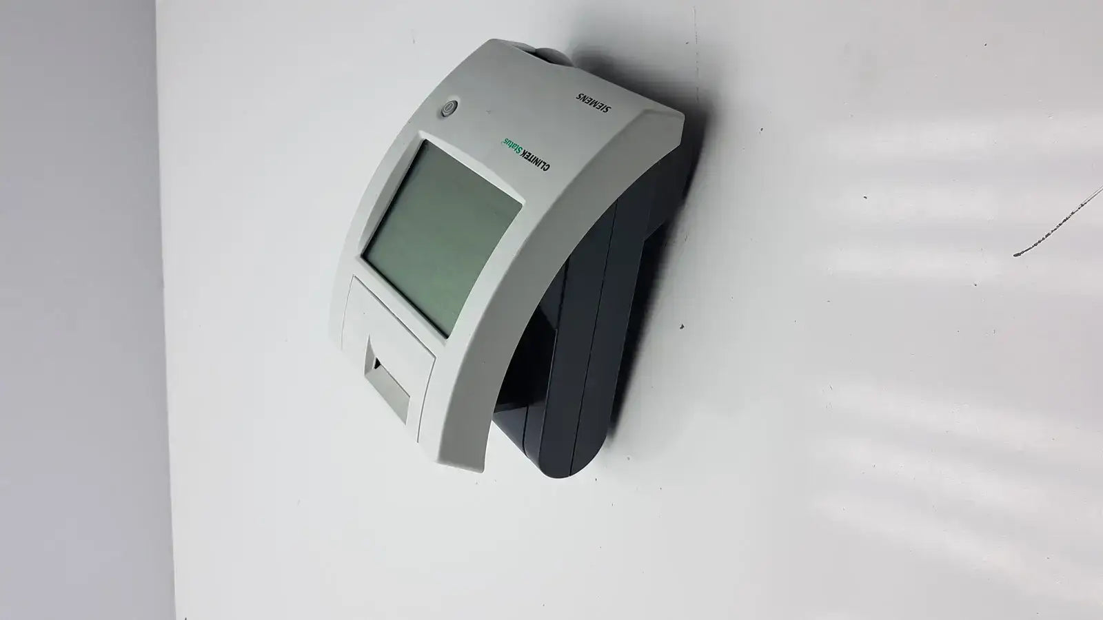 Gray and black siemens clinitek status analyzer card reader with rectangular screen and card insertion slot model 004979