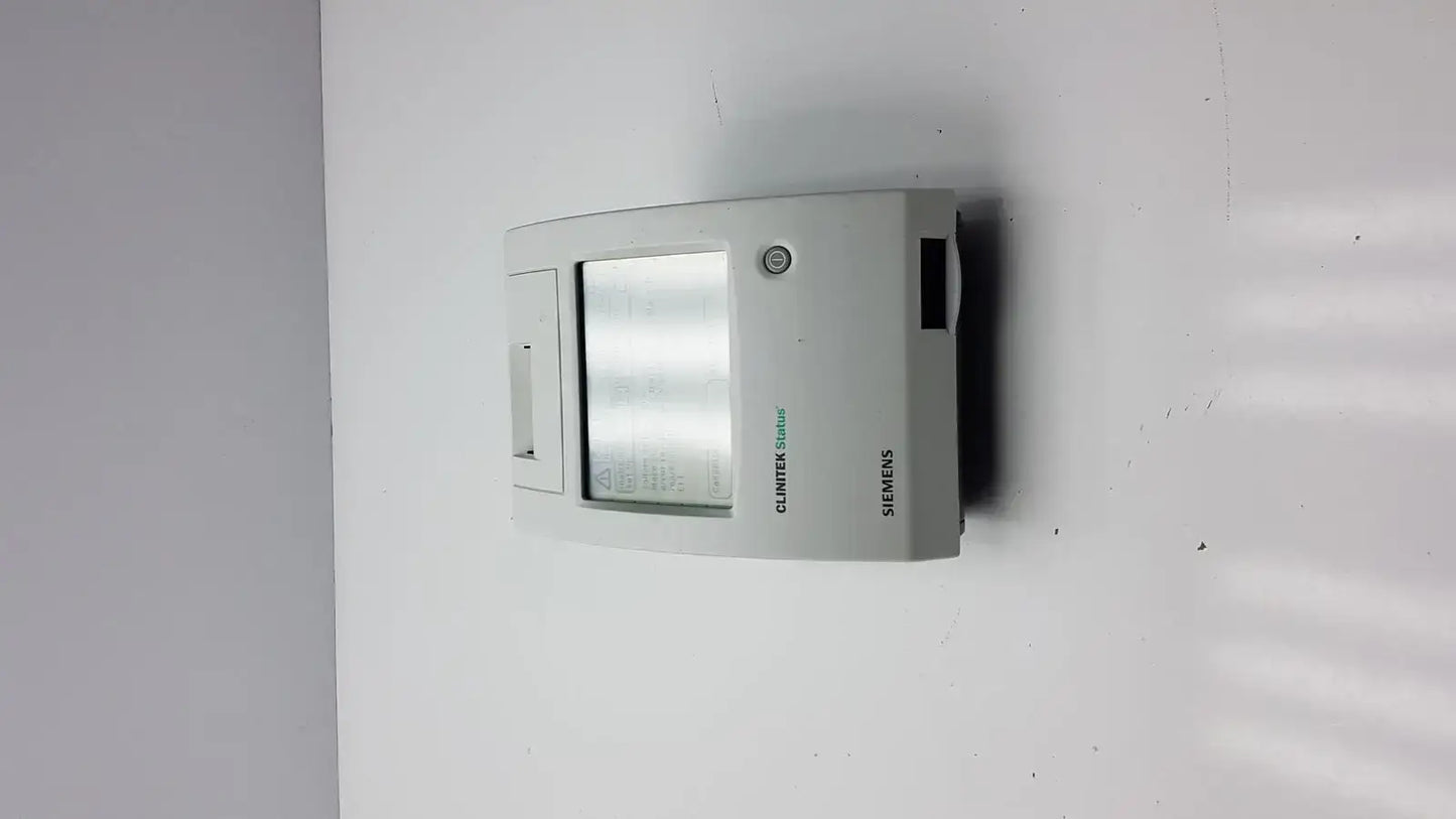 Gray siemens clinitek status analyzer wall-mounted thermostat with rectangular digital display and control panel