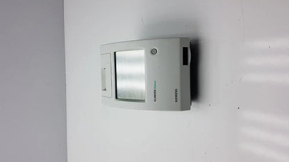 Gray siemens clinitek status analyzer wall-mounted thermostat with rectangular digital display and control panel