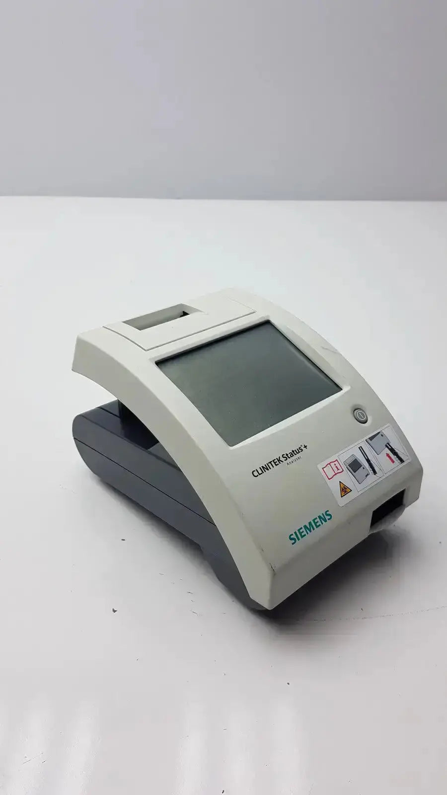Siemens Clinitek Status Analyzer 2015 with gray white plastic casing rectangular screen and control buttons for medical use