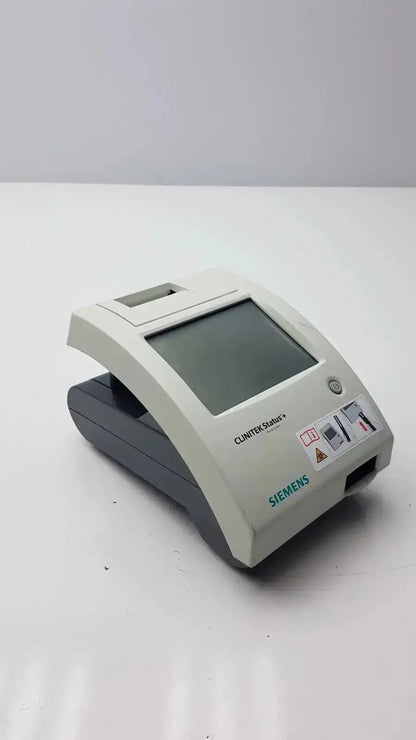 Siemens Clinitek Status Analyzer 2015 with gray white plastic casing rectangular screen and control buttons for medical use