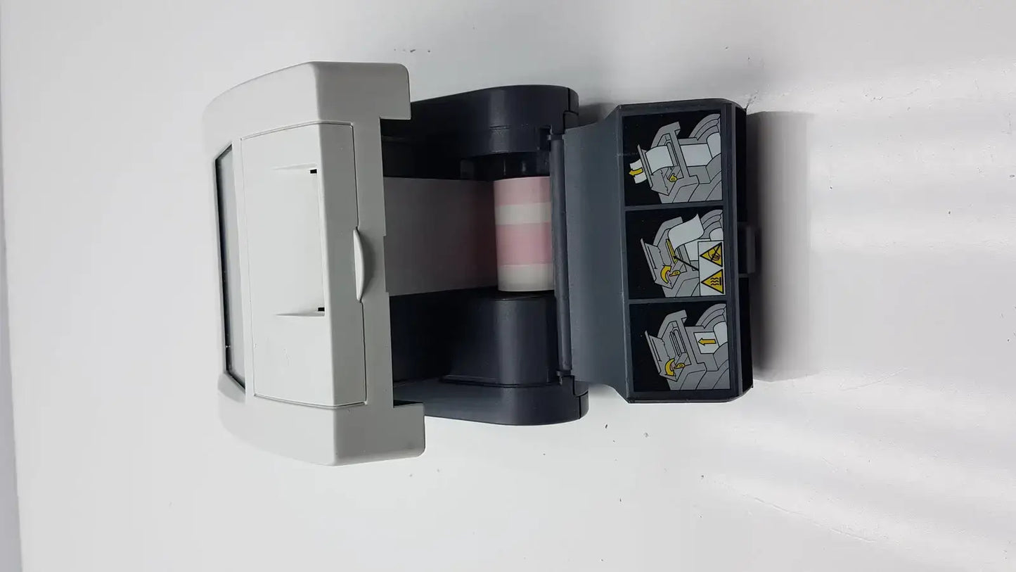 Gray and black siemens clinitek status analyzer compact printer with pink striped paper roll and illustrated side compartments