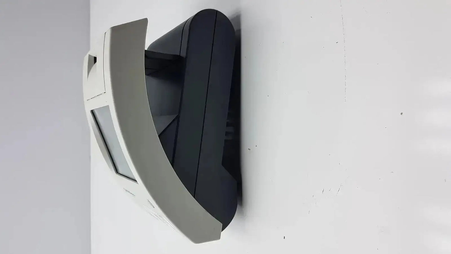 Gray and black wall-mounted atm machine with curved front panel in siemens clinitek status analyzer 004979 model