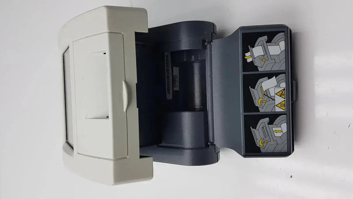 Gray plastic siemens clinitek status analyzer with hinged lid and three illustrated compartments on the right side