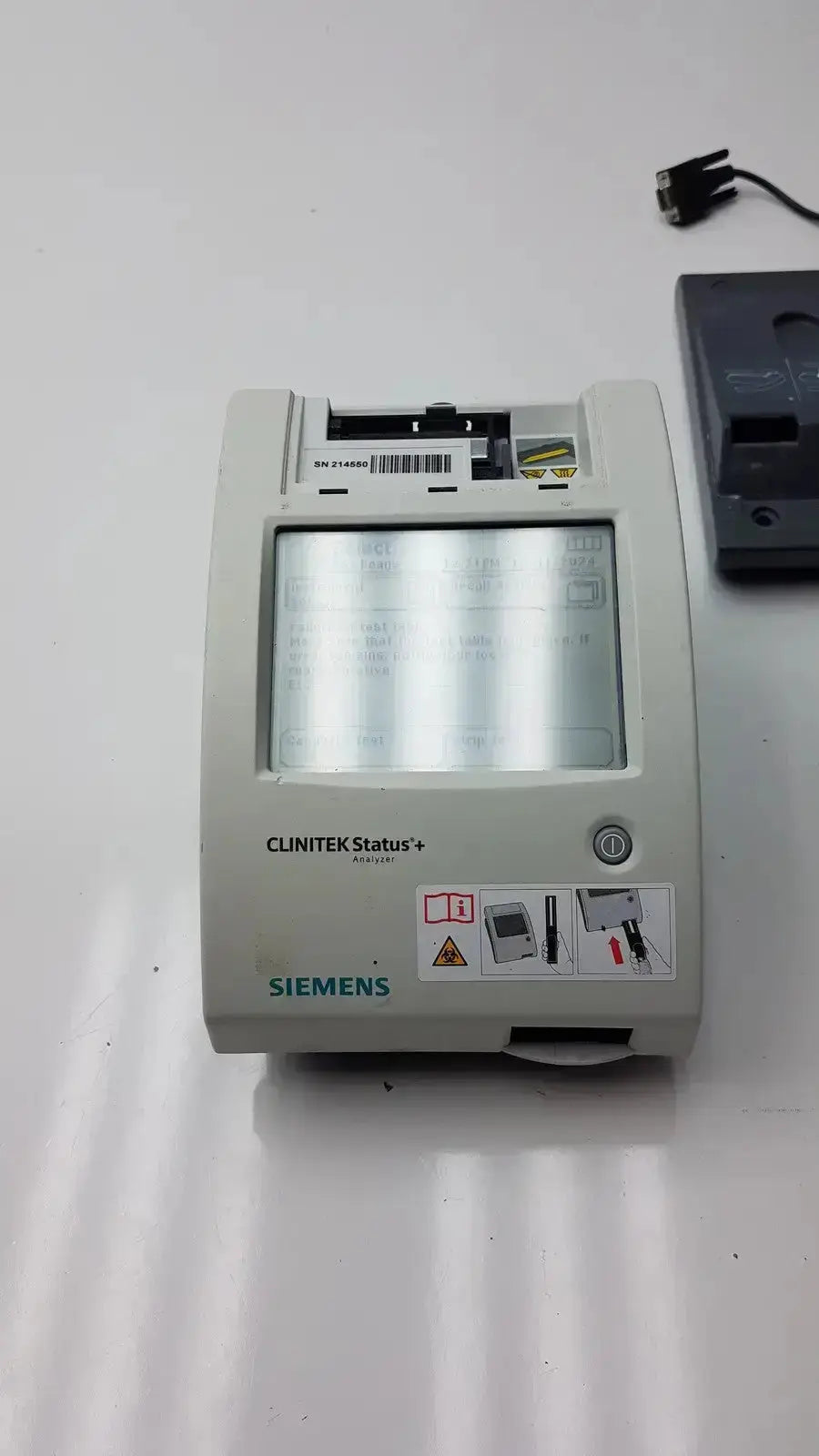 Gray Siemens Clinitek Status+ medical analyzer with rectangular screen and control buttons for clinical testing