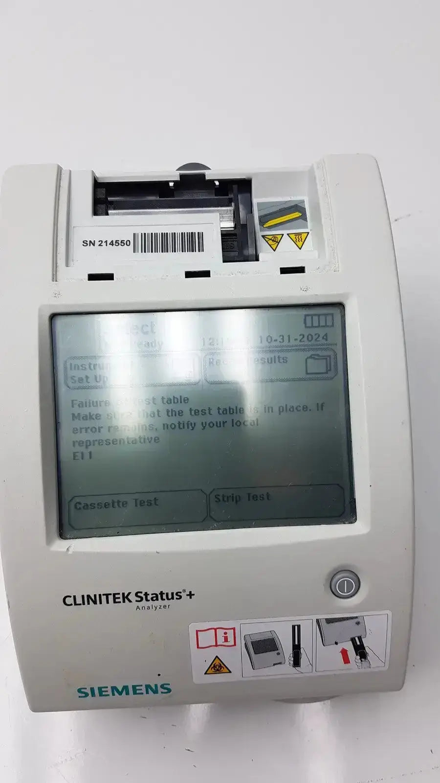 White siemens clinitek status analyzer model 004979 with digital display showing test instructions and error messages