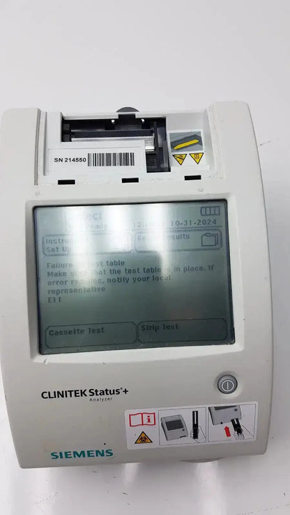 White siemens clinitek status analyzer model 004979 with digital display showing test instructions and error messages