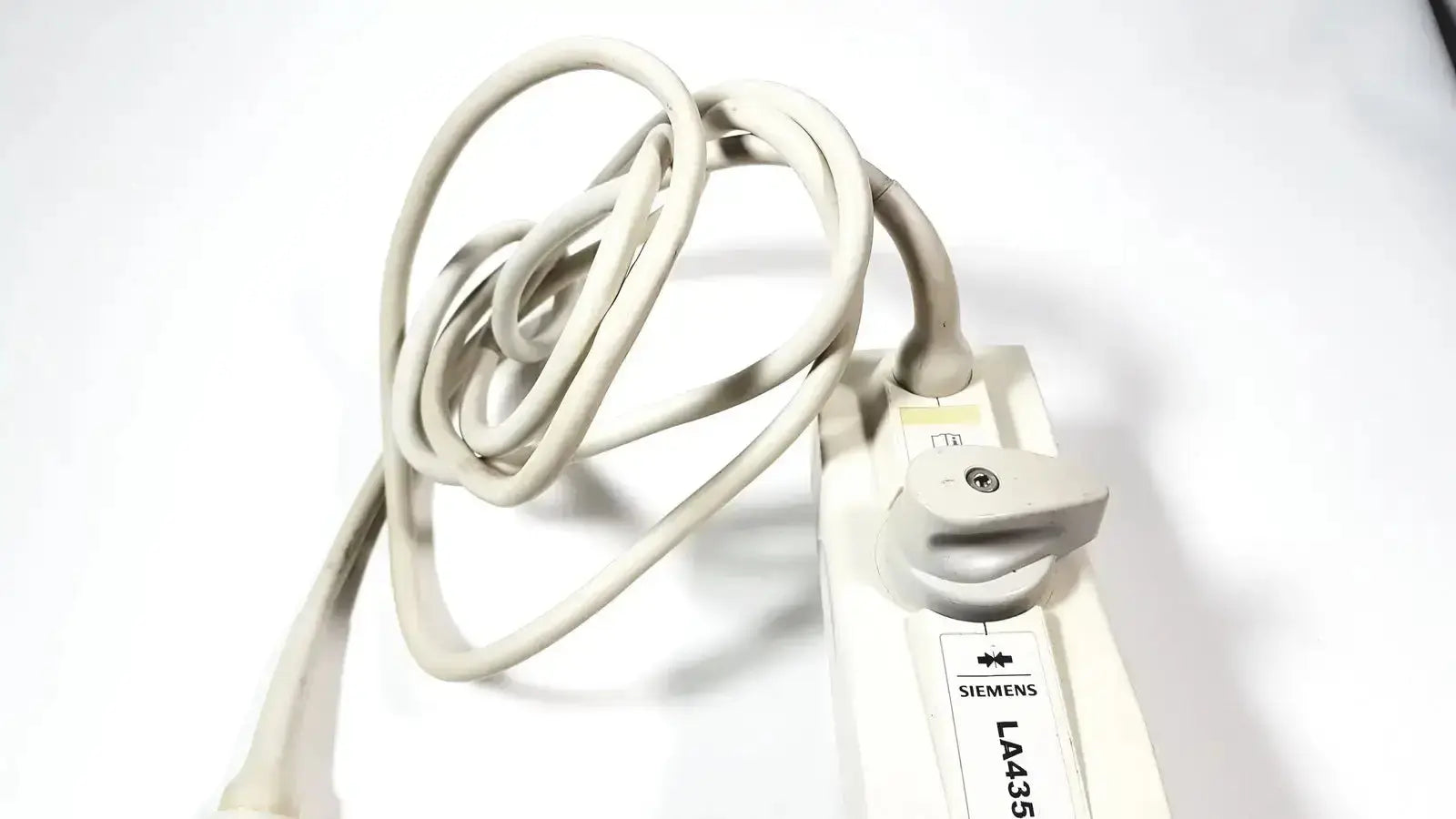 Beige siemens la435 transducer probe with coiled cable and white connector for acuson p300 portable ultrasound